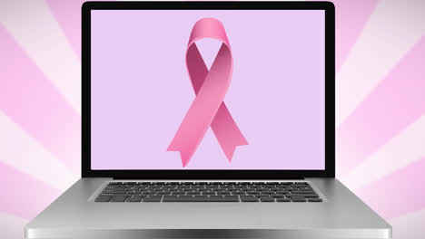 Animation-of-pink-ribbon-logo-on-laptop-screen
