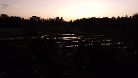 sunrise over the silhouette landscape of licin in east java, indonesia