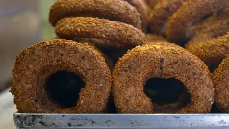 close-up of a pile of sesame seed bread rolls