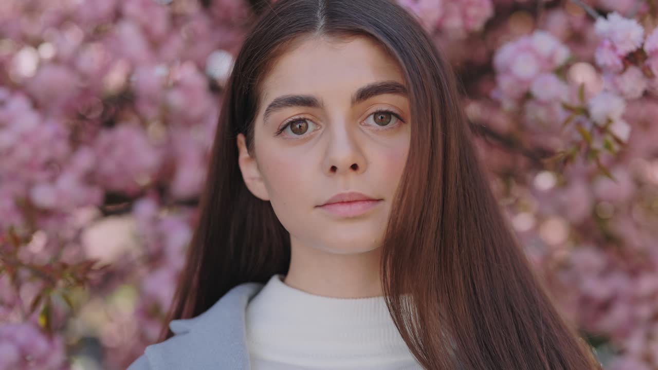 Young Woman in Cherry Blossom Trees