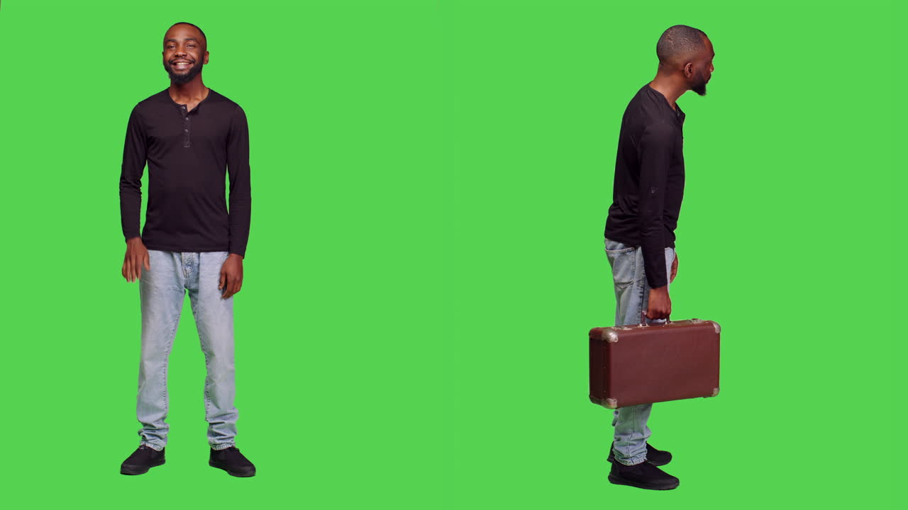 African American man with suitcase on green screen