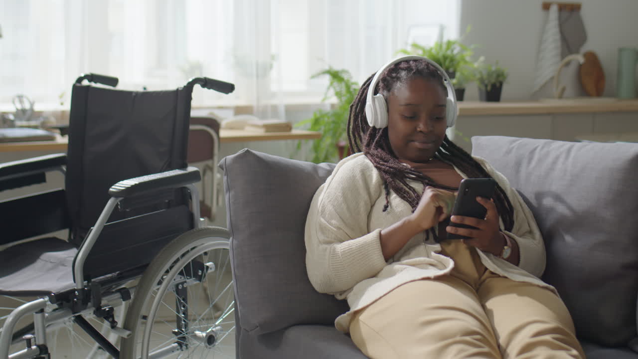 Woman with Disability Listening to Music at Home