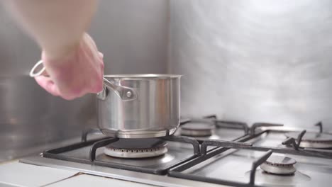 static-shot-of-a-pot-being-put-on-a-stove