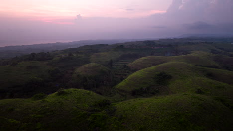 aerial view of teletubbies hill at sunset in nusa penida, bali, indonesia