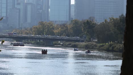 boats moving along the yarra river