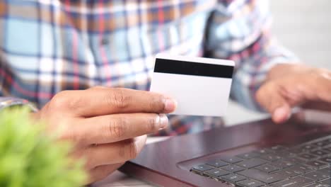 person paying online with credit card