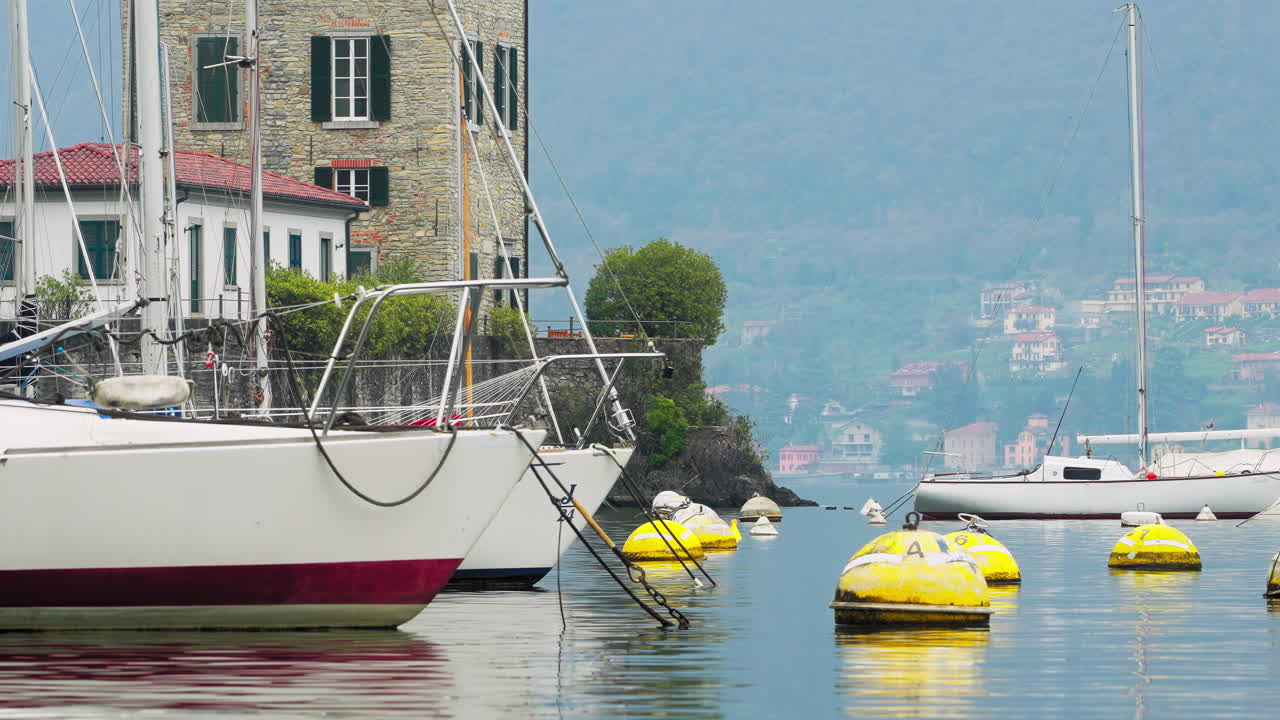 Yachts anchored on the coast of Bellagio, Lake Como, Italy