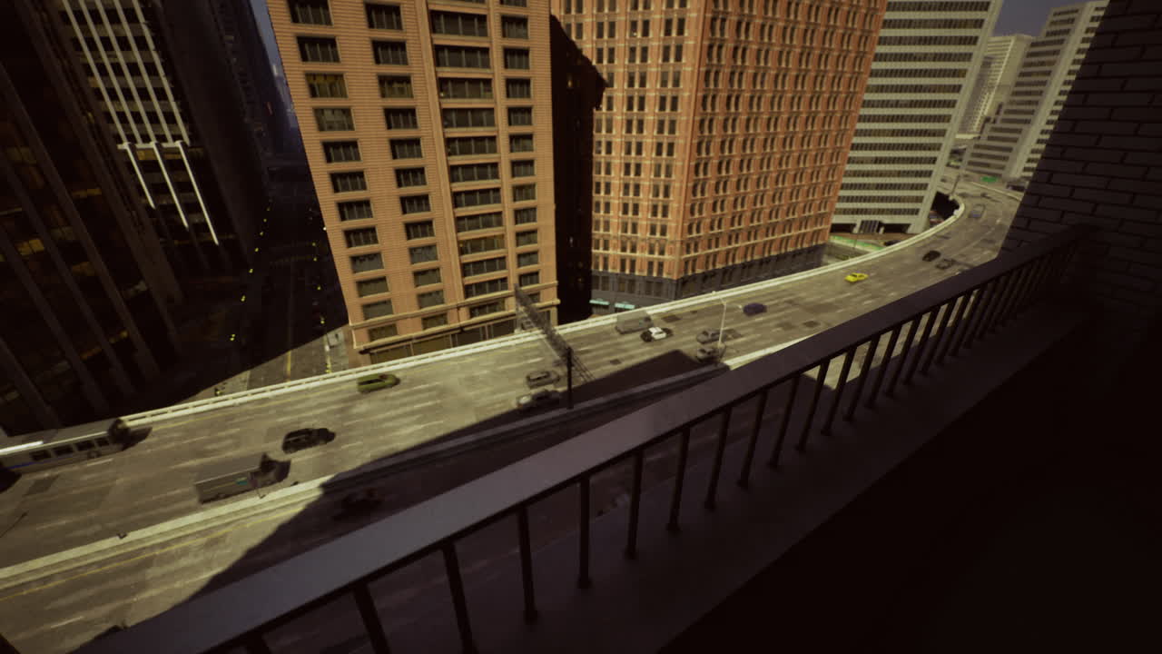 View from high rise balcony overlooking busy city street during daytime