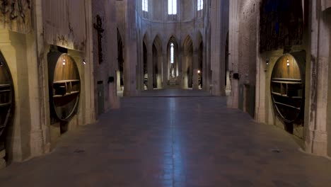 interior view inside a french abbey, monastery with huge wine barrels.