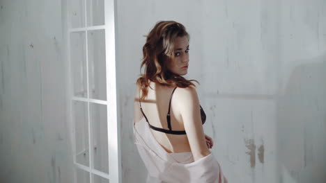 woman in pink robe and lingerie