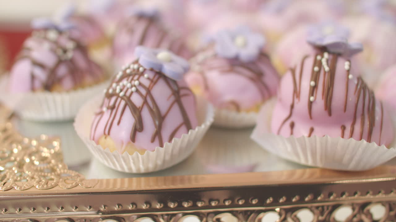 DELICIOUS PASTRIES WITH SOFT SWEET LAVANDER COLOR TOPPING PLUS A CHOCOLATE TOUCH.