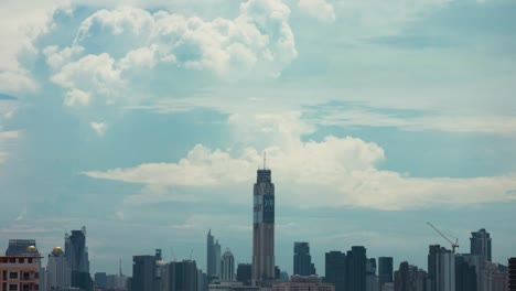 dynamic skyline of bangkok in time-lapse view from baiyoke sky hotel on a sunny summer day