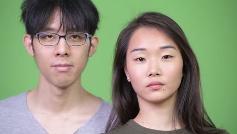 young happy asian couple smiling together