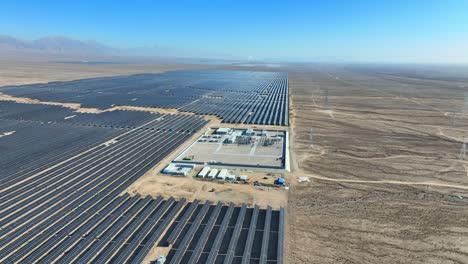 vast solar farm in open desert land hosting several pv power plants for green energy production and carbon neutrality - mdgs