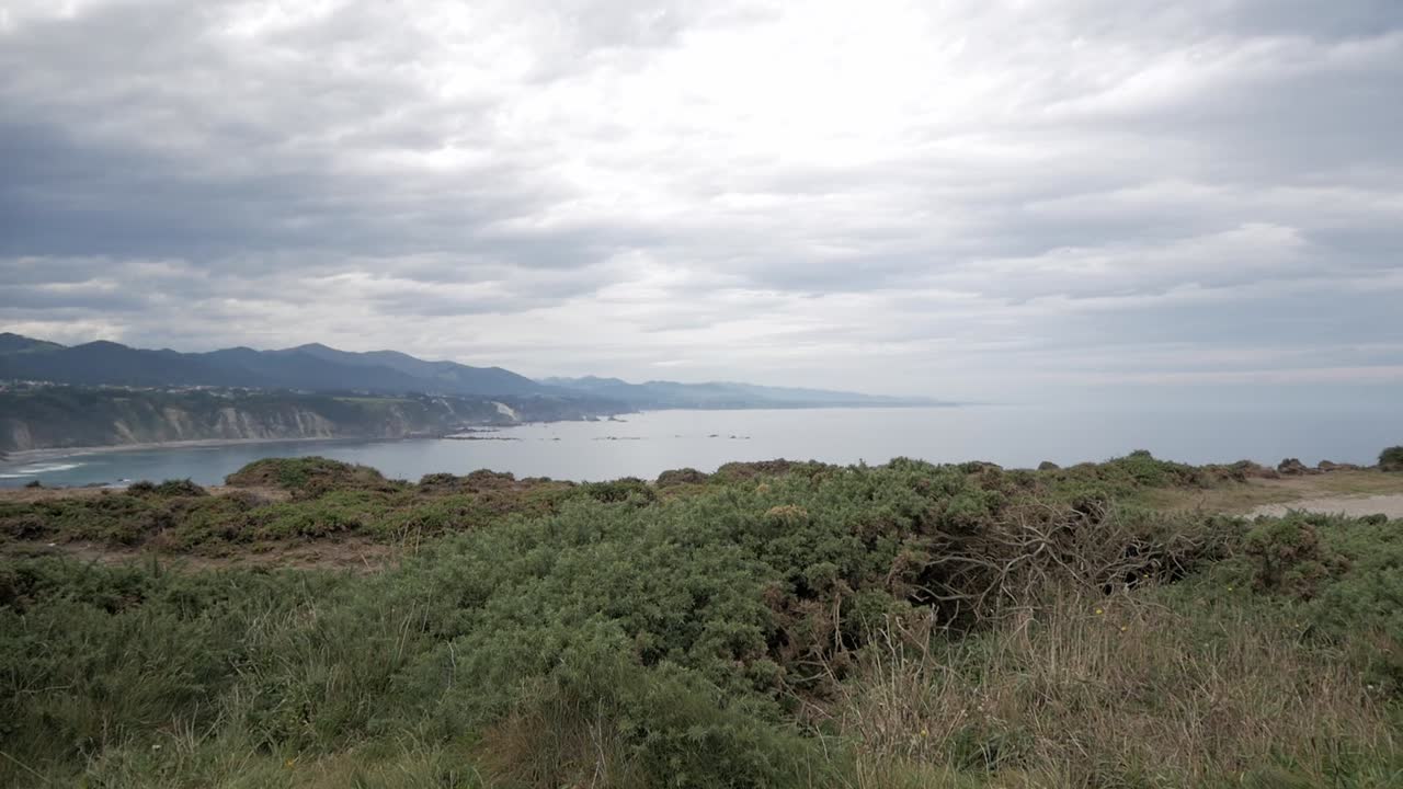 Dramatic cliffs and ocean view near Faro de Cabo Vidio, Asturias on cloudy day