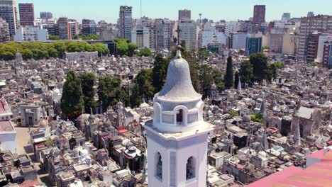 Aerial-orbit-of-the-bell-tower-of-the-basilica-of-Nuestra-Señora-del-Pilar-with-the-Recoleta-cemetery-in-Buenos-Aires-on-a-sunny-day