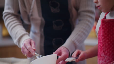 man cracks a raw egg in a bowl preparing a glaze