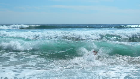 ocean waves with people swimming