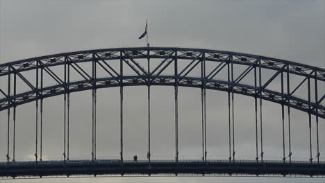train moves across sydney harbour bridge during the early morning, australia