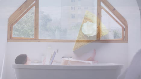 person relaxing in bathtub reading book with pie slice animation over window