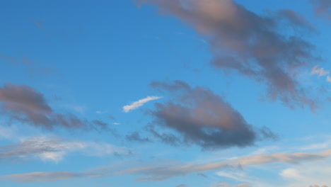 Slow-moving-clouds-against-the-blue-sky