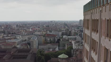 milan cityscape and side of velasca tower, aerial drone view