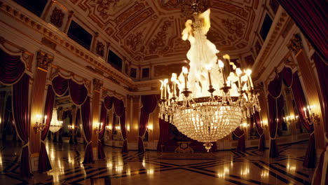 burning chandelier in a royal palace hall