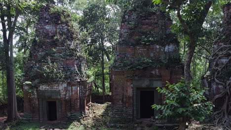 cambodian jungle has reclaimed ancient stone, brick temple at koh ker