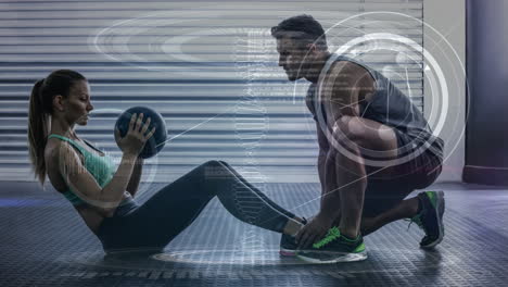 digitally composite video of trainer assisting woman in exercising 4k