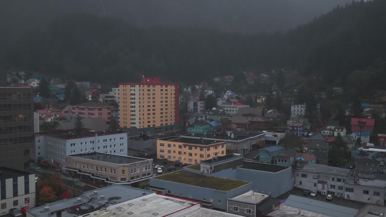 Aerial low panning shot of historic downtown Juneau during a rainy fall day in Alaska. 4K