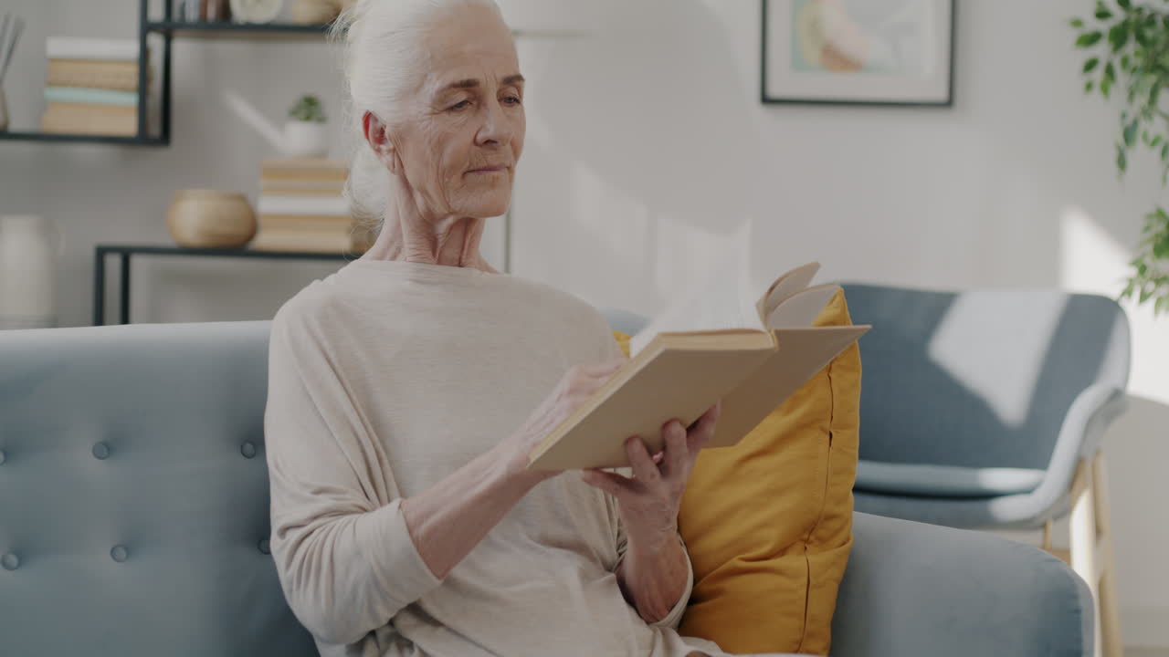 Elderly Woman Reading a Book at Home