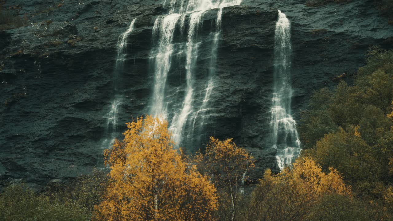 Thin fog hangs above the waterfall on the Aselvi river