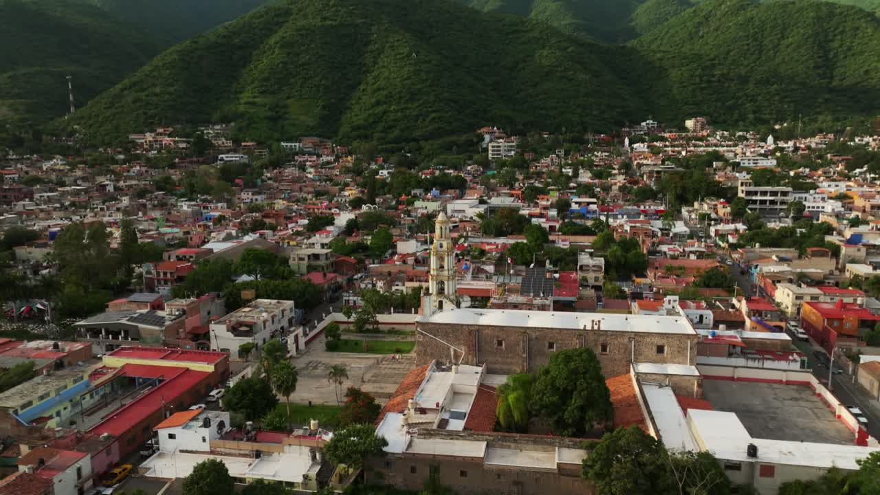 Our Lady Of The Rosary Church In Ajijic City Center, Jalisco, Mexico - Backward drone reveals cityscape