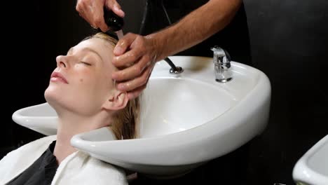 woman getting her hair wash