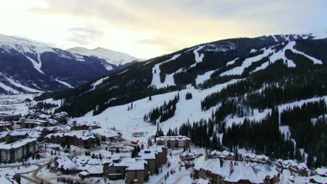 Aerial-drone-panning-shot-of-running-ski-lifts-on-Copper-Mountain-during-sunrise