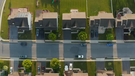 aerial top down of suburban homes along quiet street