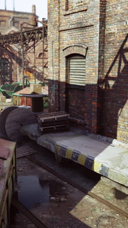 abandoned industrial building with railroad tracks