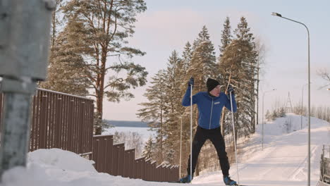 man cross-country skiing in winter landscape