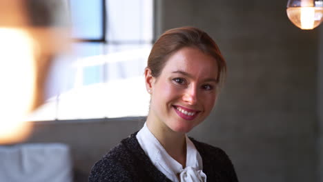 young caucasian businesswoman smiling in an office