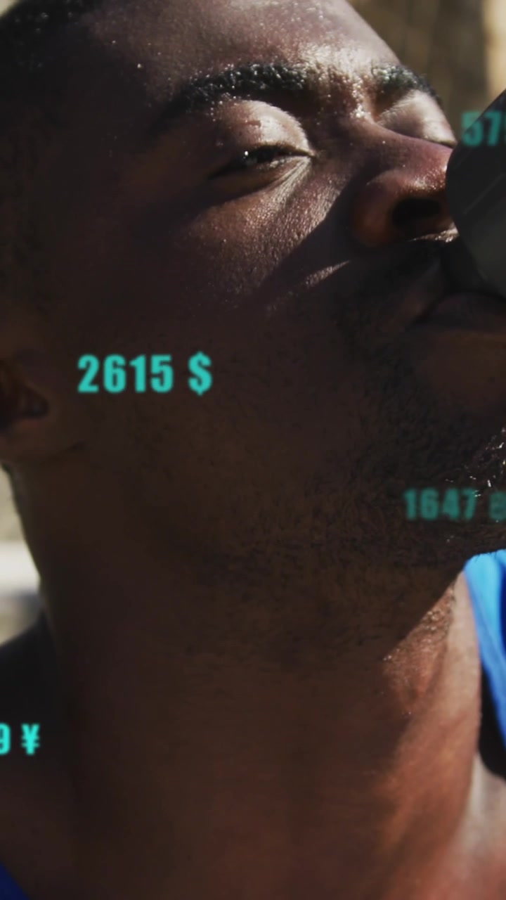 Animation of changing numbers, currency symbols, tired african american athlete drinking water