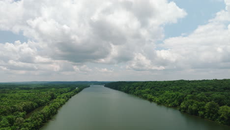river with densely forest at mousetail landing state park near linden in perry county, tennessee, usa