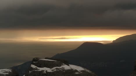 winter sunrise over mountain and ocean