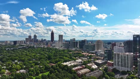 greened park in front of skyline buildings during sunny day