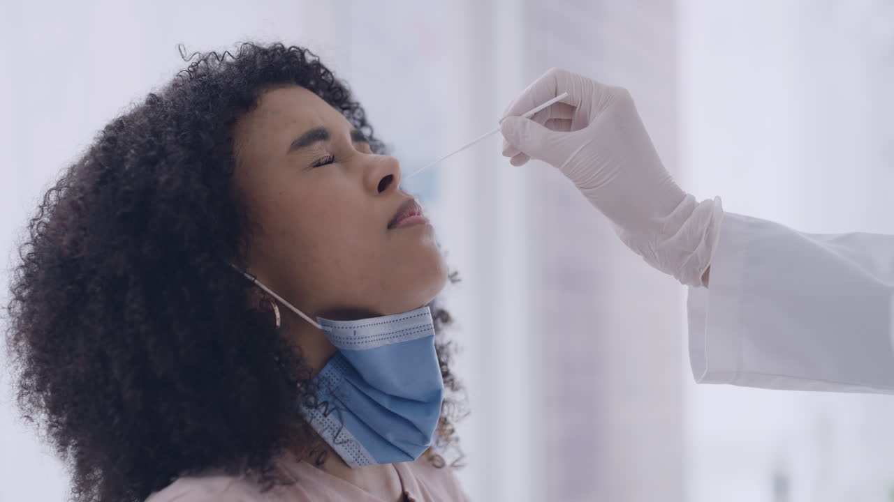 Collecting a covid sample from the young patient