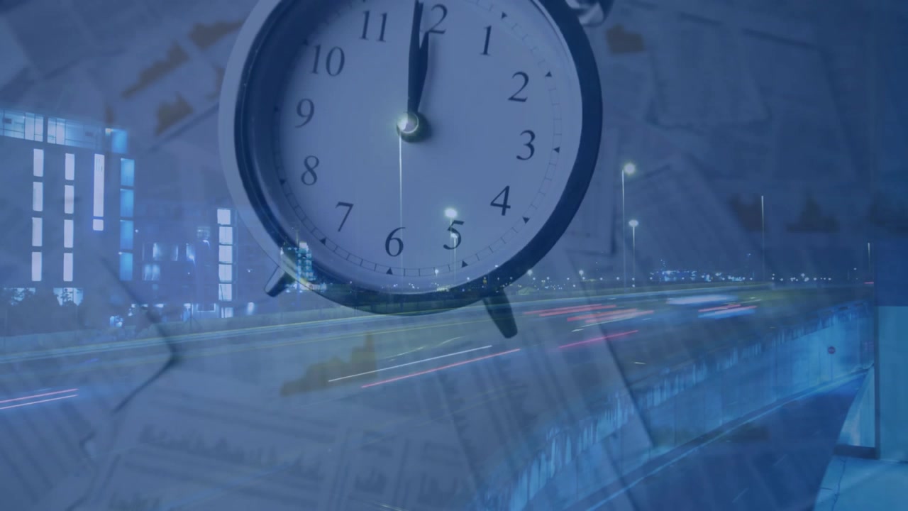 Double Exposure of Alarm Clock and Night City Traffic