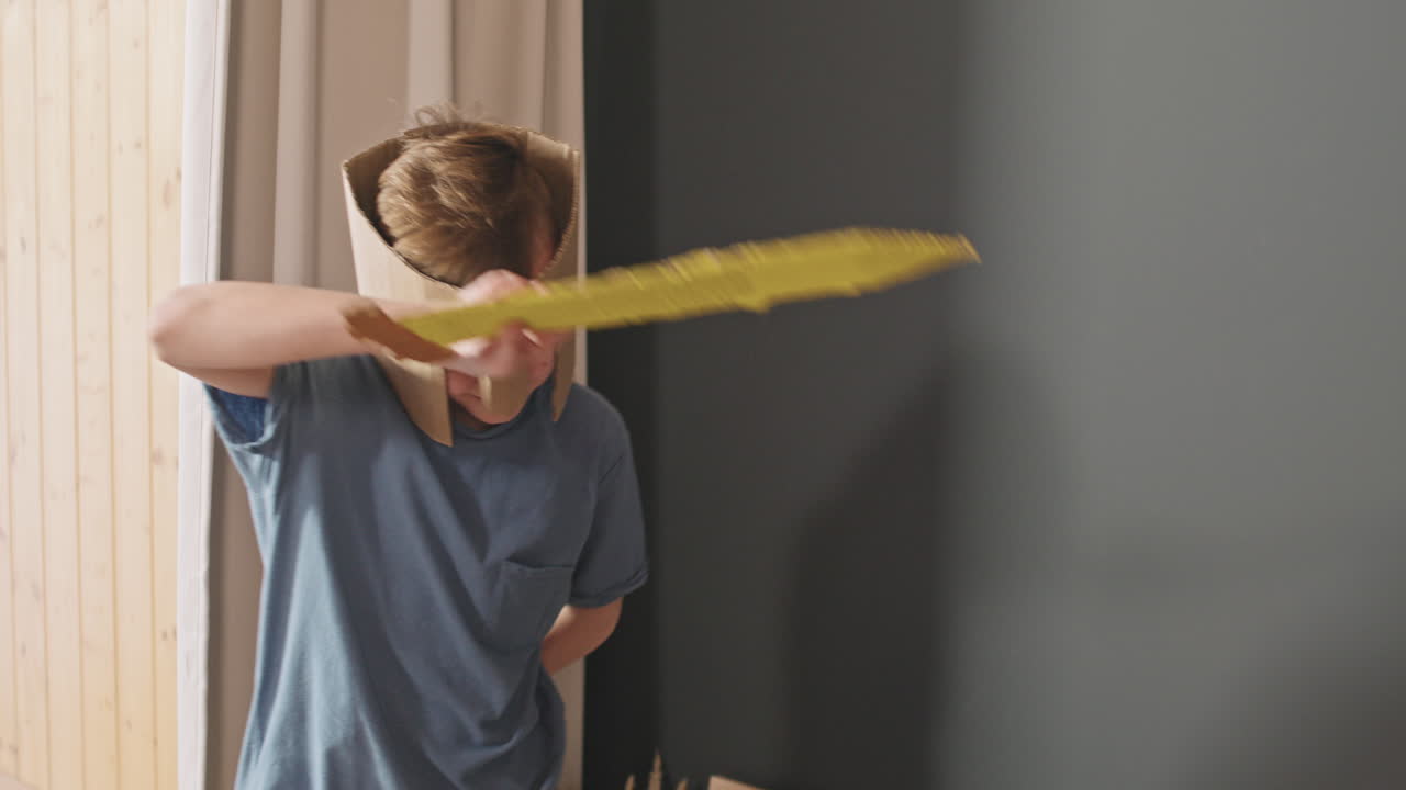 Boy Fighting With Toy Swords With Little Sister