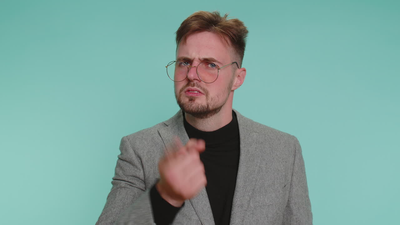 Displeased man gesturing hands with irritation displeasure blaming scolding for failure asking why