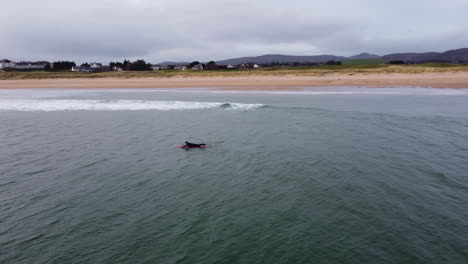 the scottish ocean lapping up on both sides of a sand bank ariel drone shot