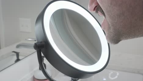 side angled view of using a ring lit mirror