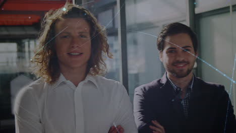 Animation-of-network-of-connections,-light-spot-over-portrait-of-two-diverse-men-smiling-at-office